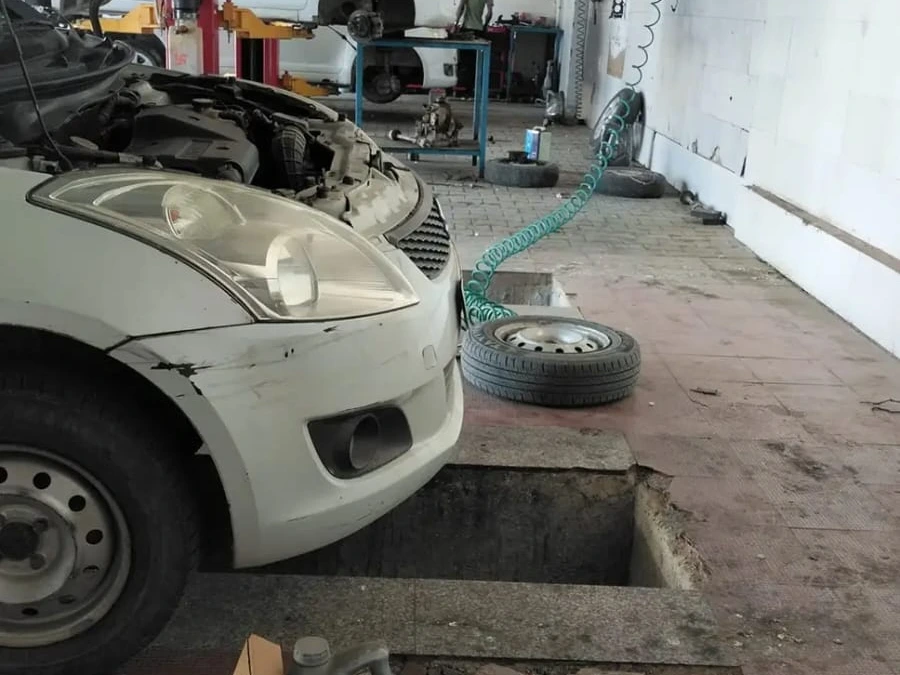 cars parked for repair at Hari Kripa Services car workshop Ringas