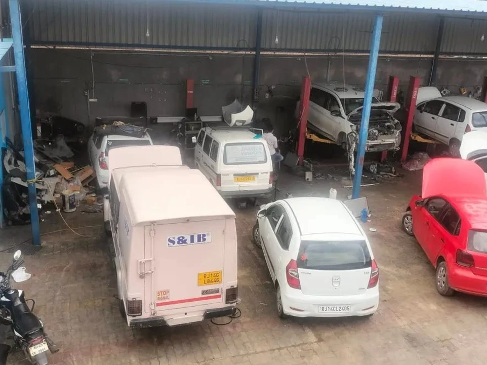 multiple vehicles being serviced at HKS car service center Jaipur